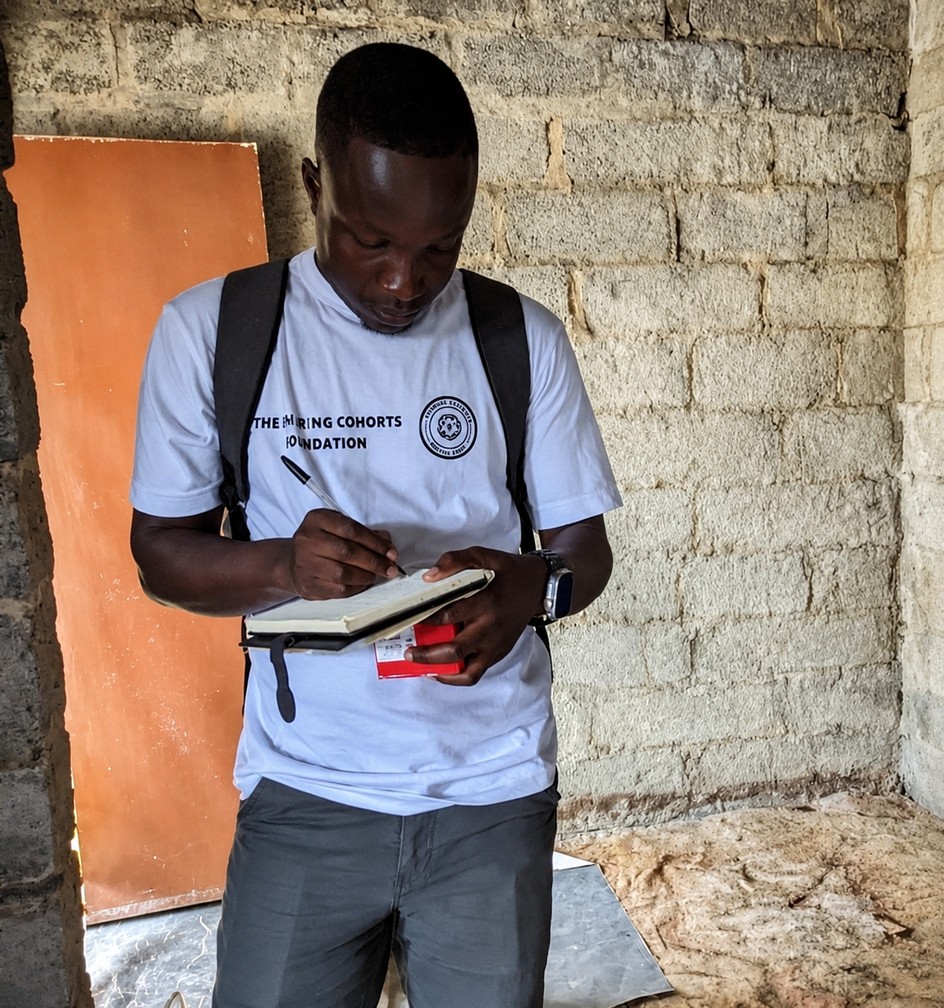 Caristo taking notes as Vice Secretary during a Sharing Cohorts Foundation outreach